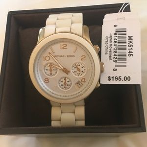 White Michael Kors watch.